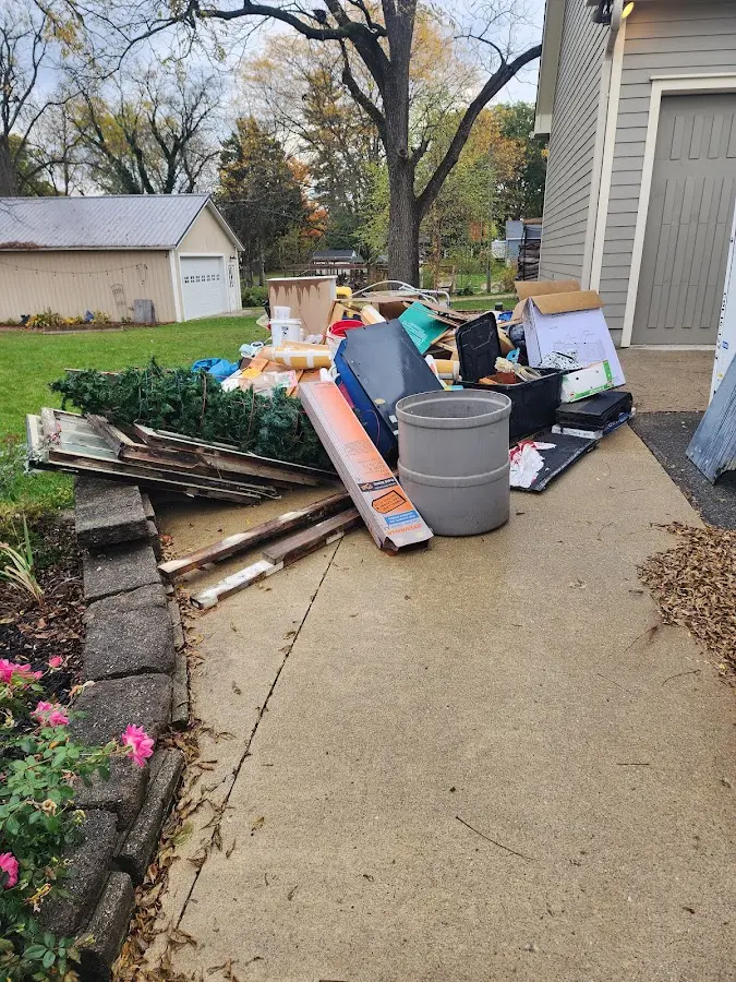 Dumpster being loaded with debris for Estate Cleanout Dumpster Rental in Marlow